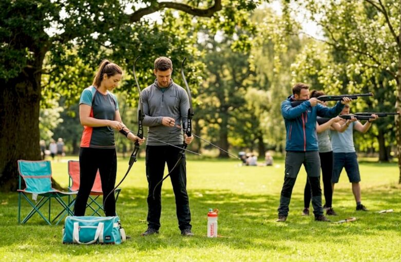 Groups using laser clay and archery outdoors