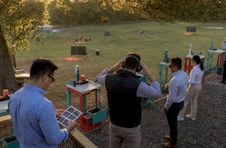Corporate team prepping for office shooting event outdoors