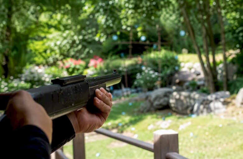 Participant shooting laser clay in team event