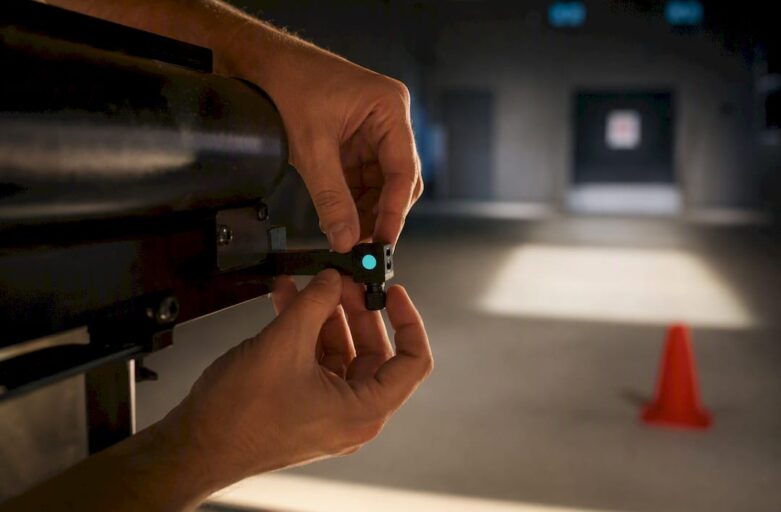 Hands checking laser clay setup alignment