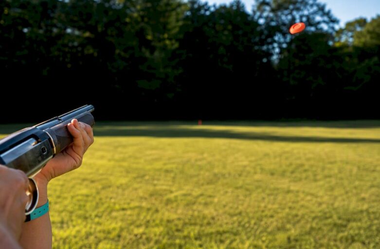 Participant tracking a flying clay target