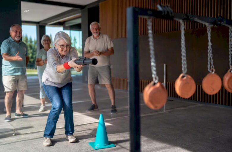 Older adults enjoying an inclusive laser clay activity