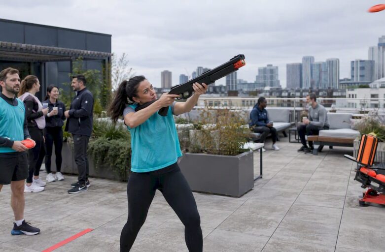 Colleagues taking turns at a laser-clay tournament