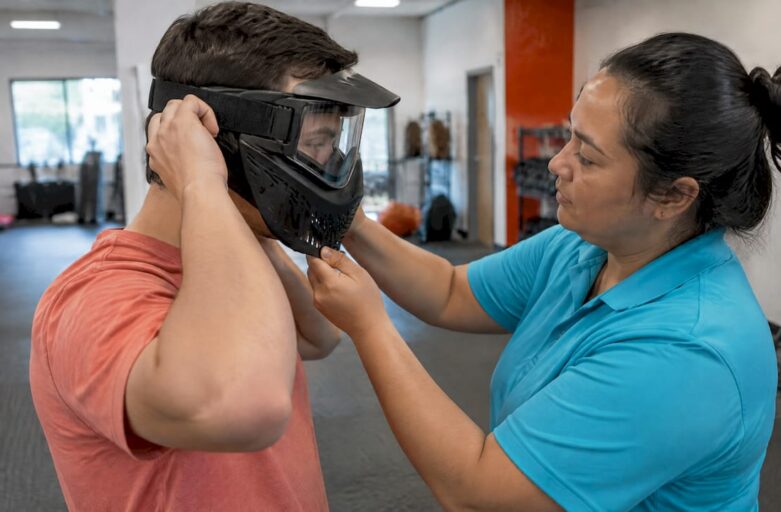 Facilitator checks a party guest’s protective mask