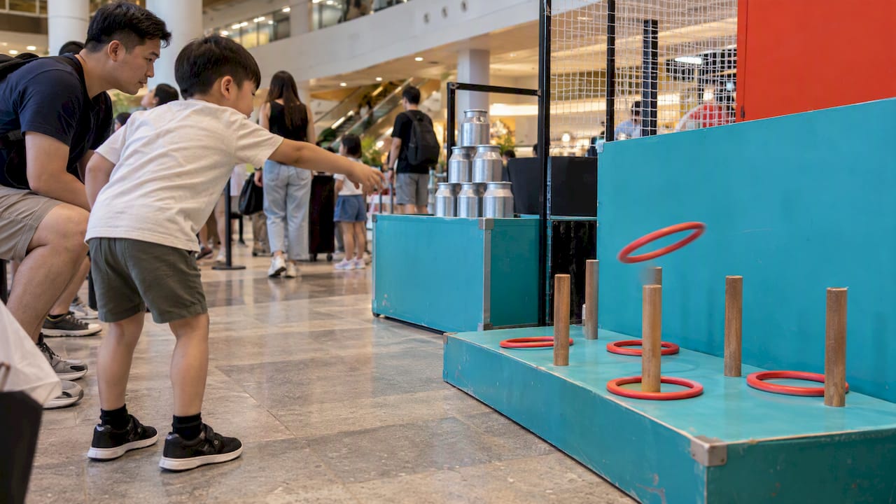 Ring toss and milk can carnival stalls
