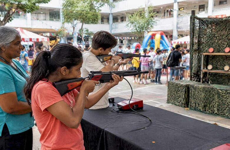 Students taking turns at a school laser clay range